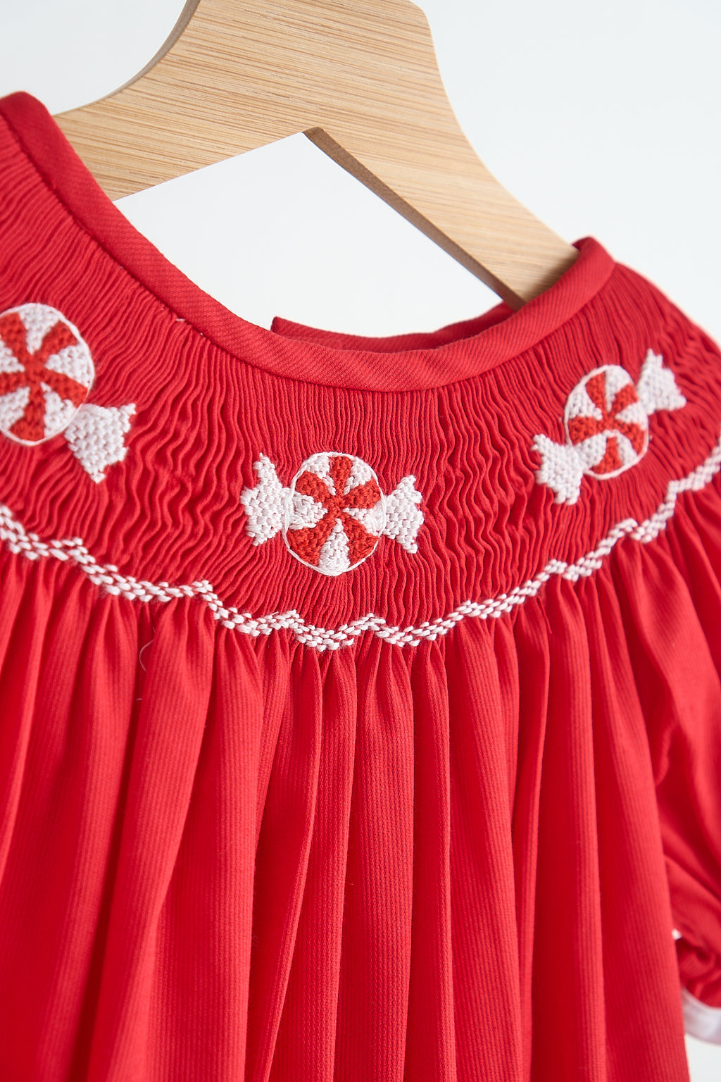 Red candy hand smocked girl romper - Giggles with Grace